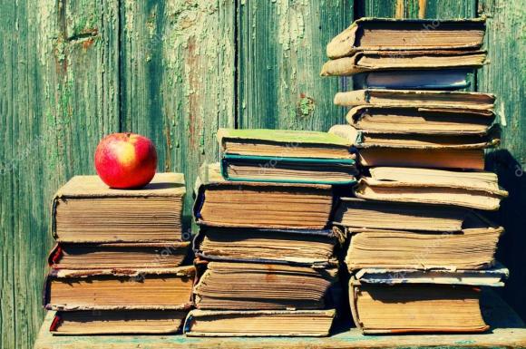 depositphotos_87761362-stock-photo-piles-of-old-books-and