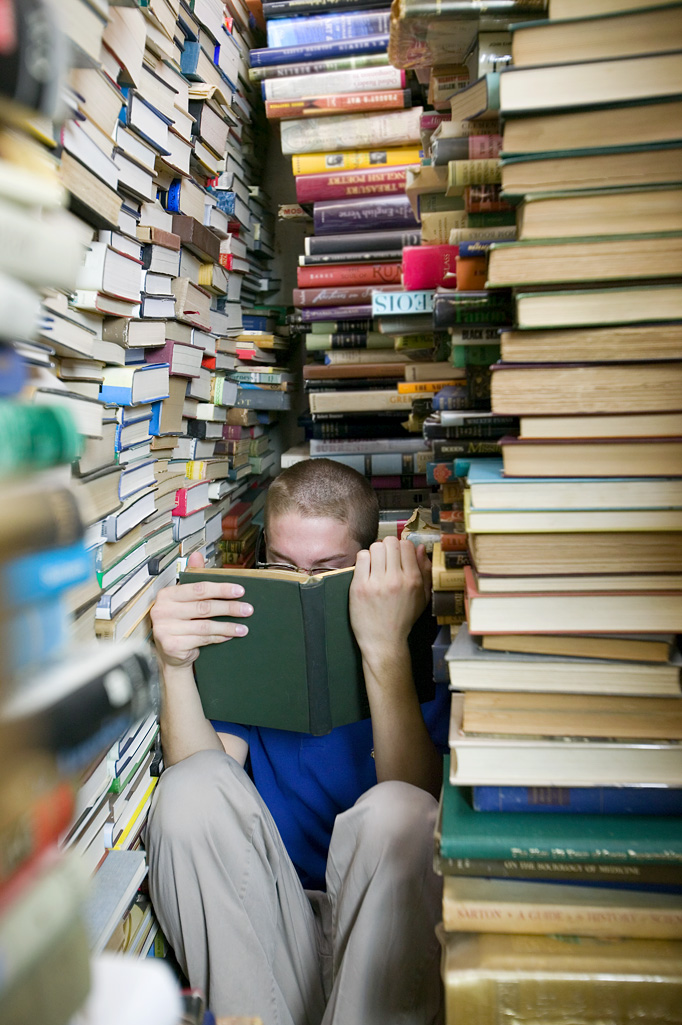 Image result for man covered in books